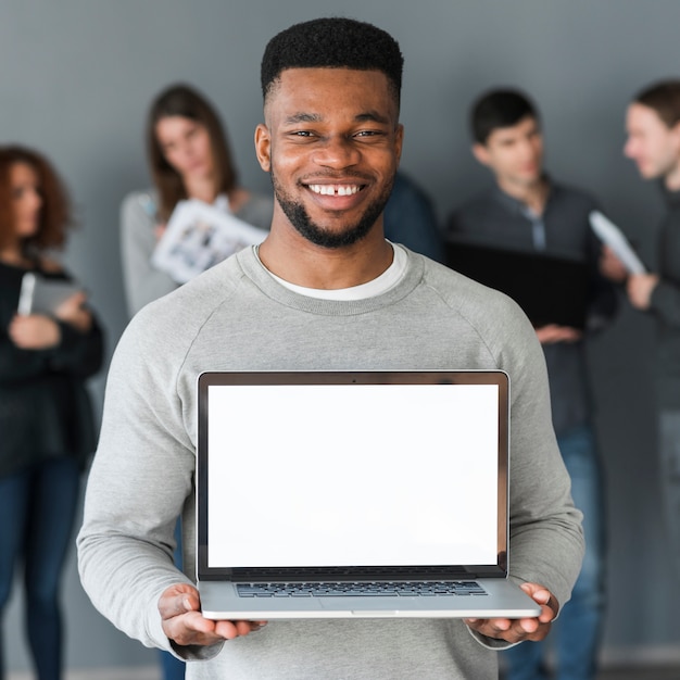 Free photo group of people holding laptop template