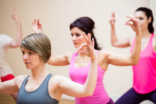 Group of people performing gyan mudra