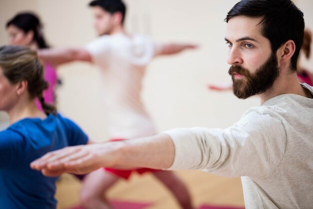 Group of people performing stretching exercise