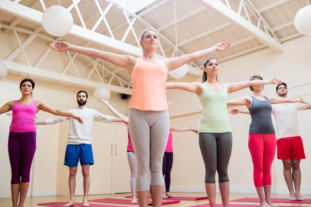 Group of people performing stretching exercise