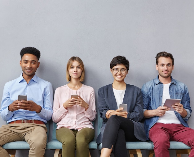 Group of people sitting in waiting room