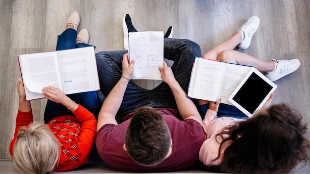 Group of people studying on floor