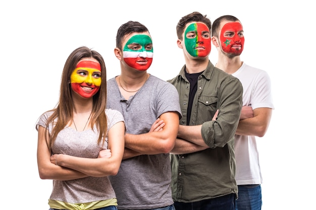 Free photo group of people supporters fans of national teams with painted flag face of portugal, spain, marocco, iran. fans emotions.