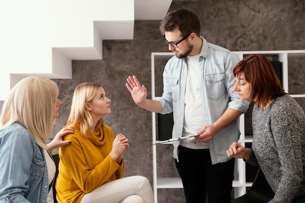 Free photo group of people at therapy session