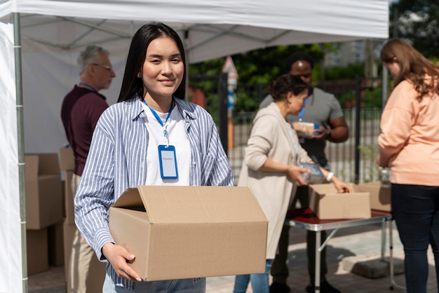 Group of people volunteering at a foodbank for poor people