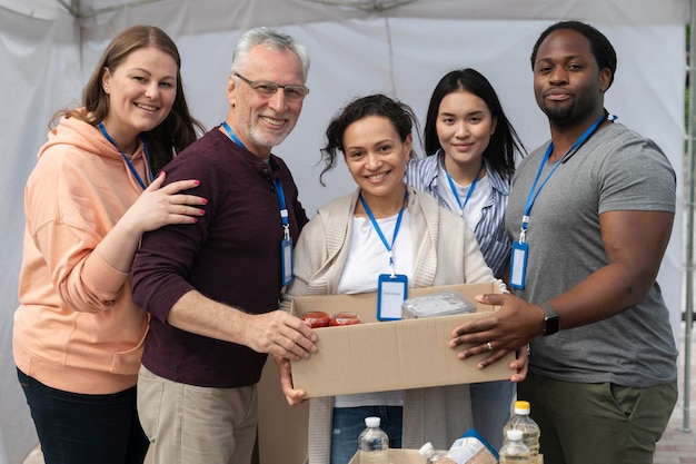 Group of people volunteering at a foodbank for poor people