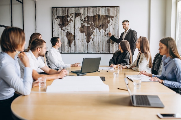 Group of people working out business plan in an office