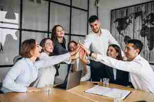 Free photo group of people working out business plan in an office