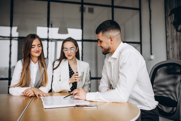 Group of people working out business plan in an office