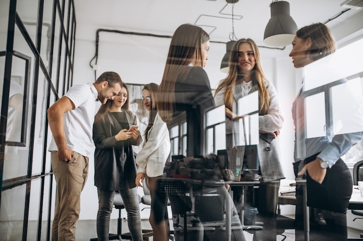 Free Photo group of people working out business plan in an office