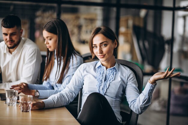 Group of people working out business plan in an office