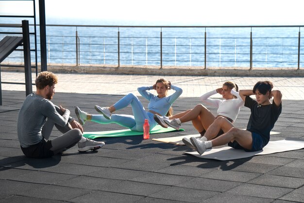 Group of people working out together outdoors