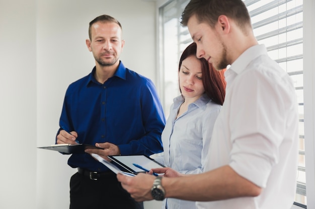 Group of people working with documents 