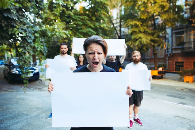 Group of protesting young people outdoors