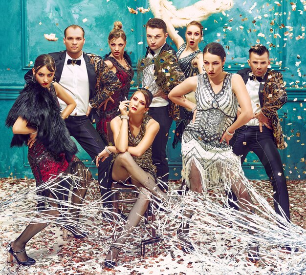 group of retro dancers with golden confetti