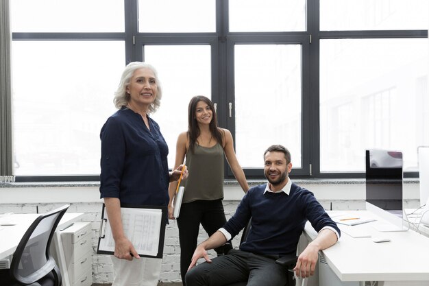 Group of smiling business people working together