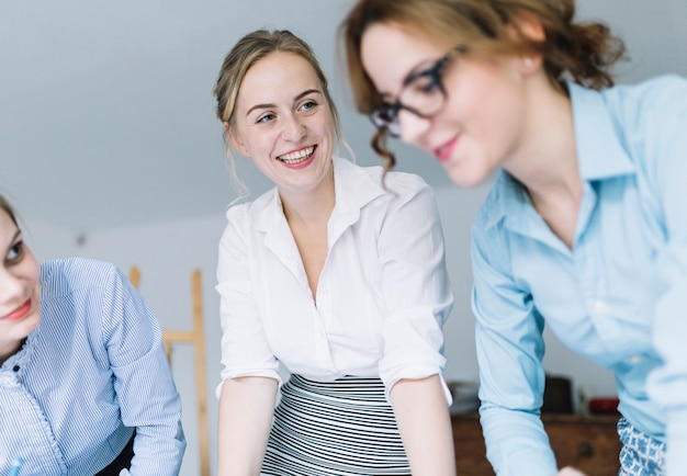 Group of smiling colleagues in meeting