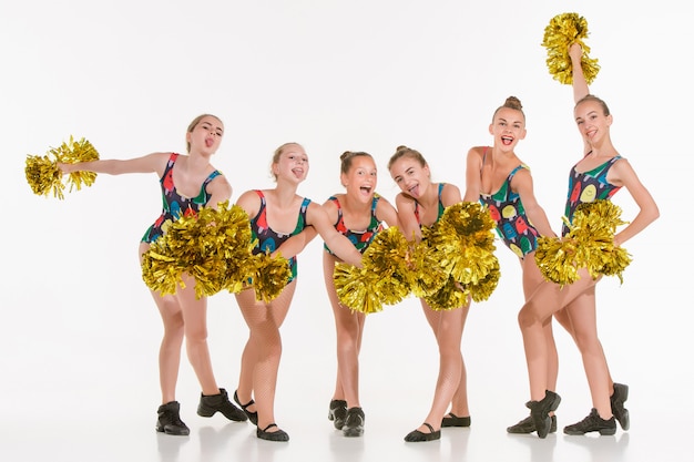 group of teen cheerleaders posing on white 