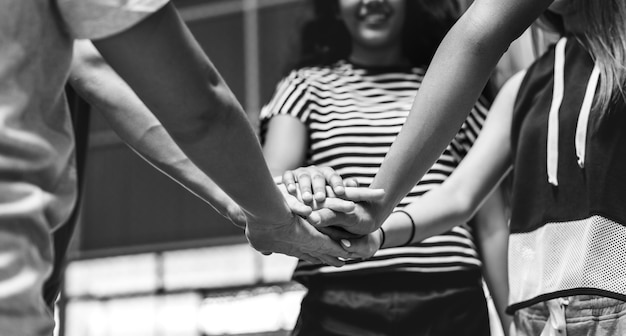 Free photo group of teenager friends on a basketball court teamwork and togetherness concept