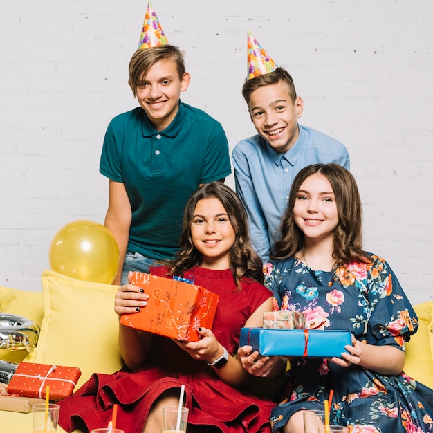 Group of teenagers on the birthday party at home