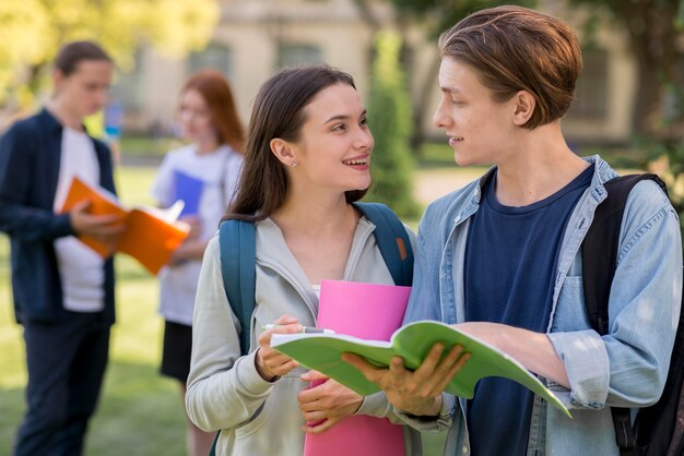 Group of teenagers discussing university project