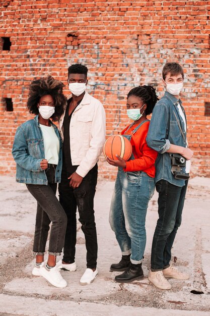 Group of teenagers posing together outdoors