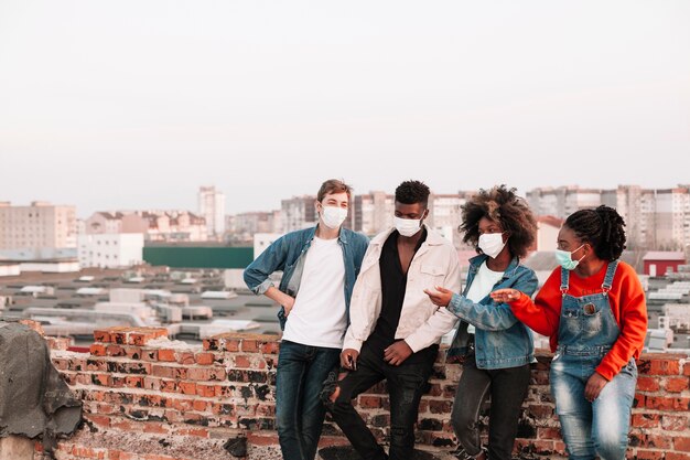 Group of teenagers posing with medical masks