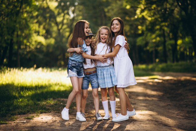 Group of teens girls having fun in forest