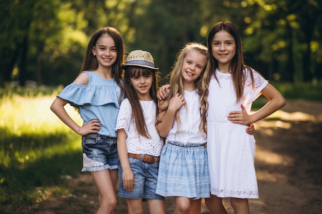 Group of teens girls having fun in forest