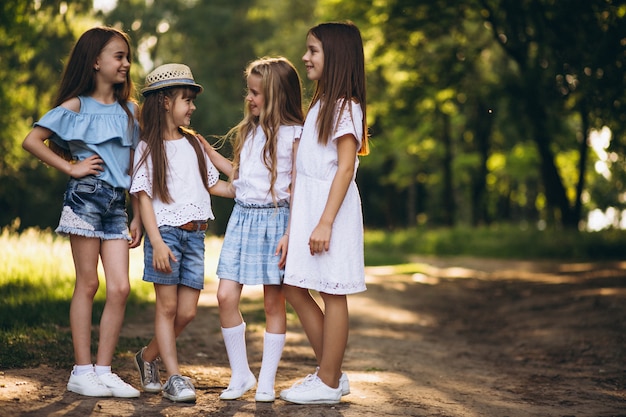 Group of teens girls having fun in forest