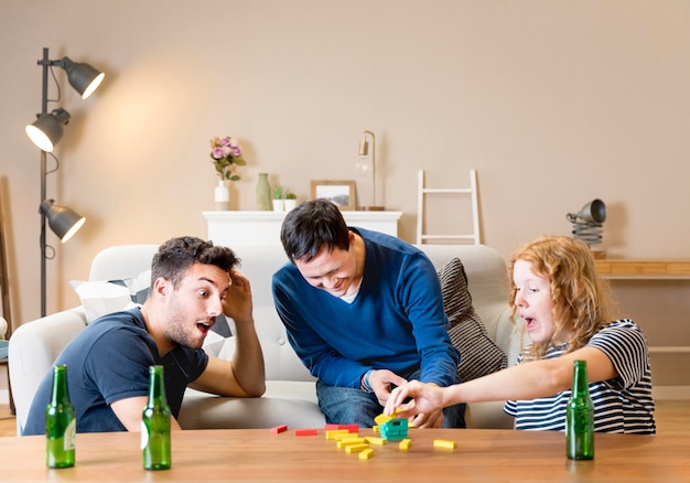 Group of three friends playing games