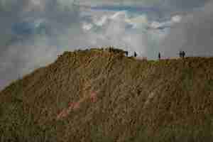 Free photo a group of tourists walk in the mountains. bali