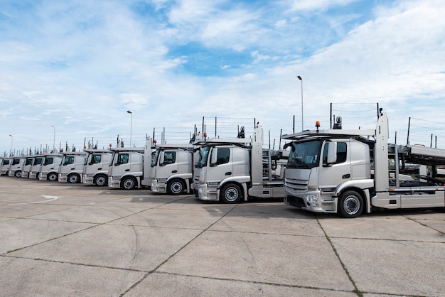 Group of trucks parked in line at truck stop