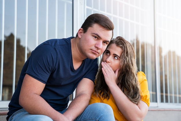 Free photo group of two friends criticizing and judging other people