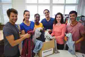 Free photo group of volunteers checking clothes