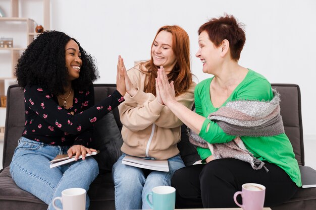 Group of women high fiving