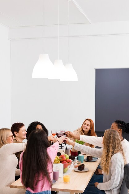 Group of women making a toast with copy space