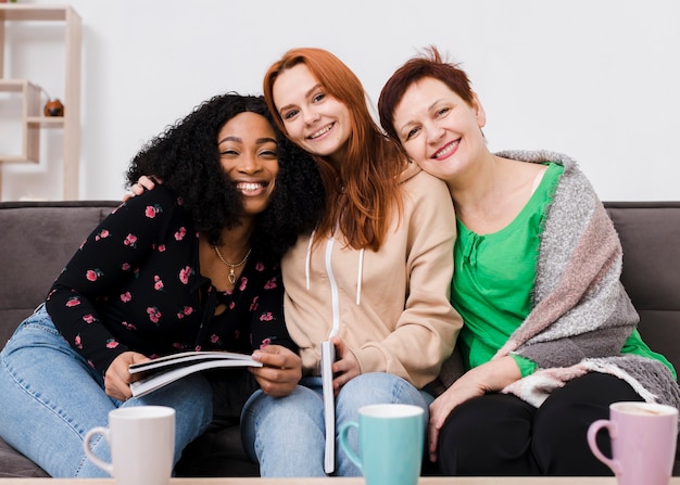 Free photo group of women posing together with books