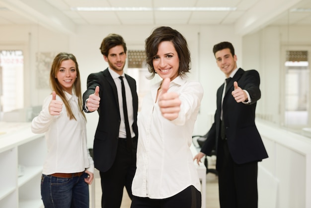 Group of workers with thumbs up