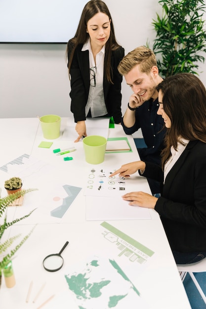 Group of young businesspeople having conversation on natural resources preservation