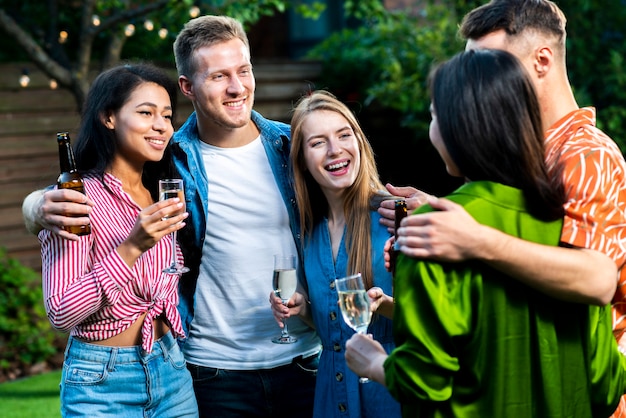 Free photo group of young friends together outdoos