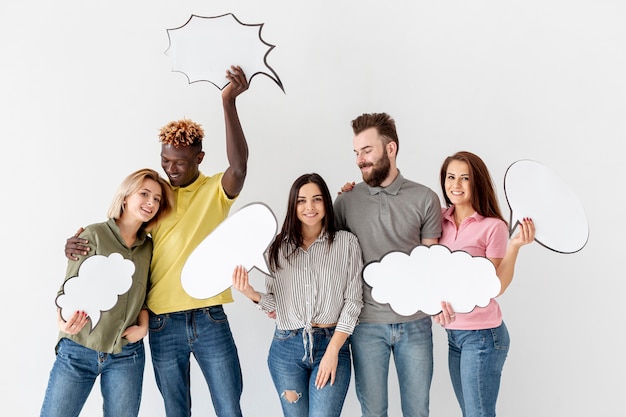 Group of young friends with chat bubbles