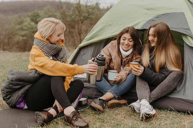 Group of young girlfriends drinking tea