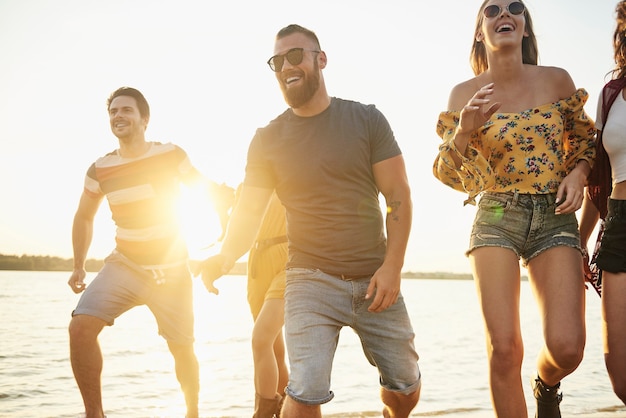 Group of young people on the fresh air at sunset