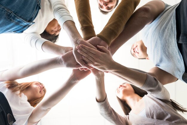 group of young people holding hands