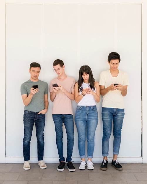 Group of young people texting