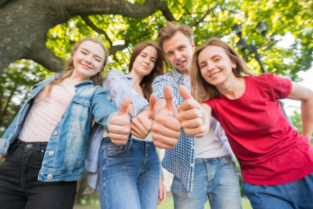 Group of young students in front of school building