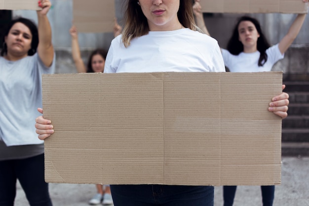 Free photo group of young women marching for equal rights