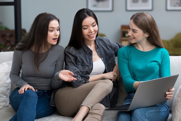 Group of young women together on the couch