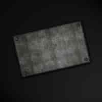 Free photo grunge metal plate on a carbon fibre background